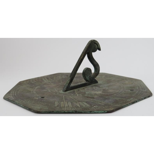 12 - A William and Mary period bronze sundial, late 17th century. The octagonal plate with angular S scro... 