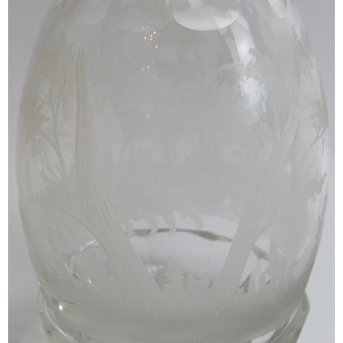 132 - Four clear glass decanters and a cocktail glass. Comprising three cut glass decanters, a decanter en... 