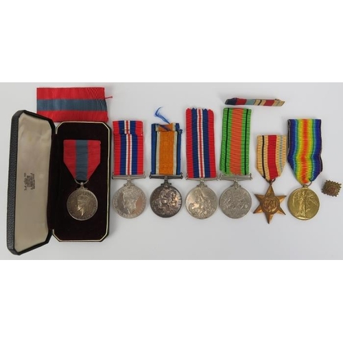 136 - Militaria: A group of World War I and World War II British military medals together with a silver Ge... 