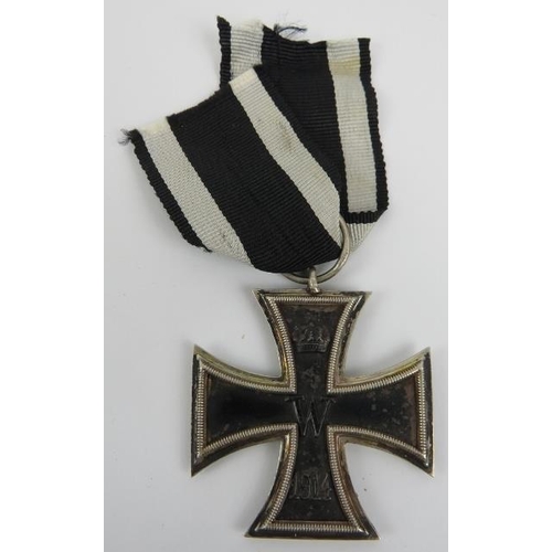 143 - Militaria: A World War I German Imperial iron cross, 2nd class, dated 1914. 
Condition report: Some ... 