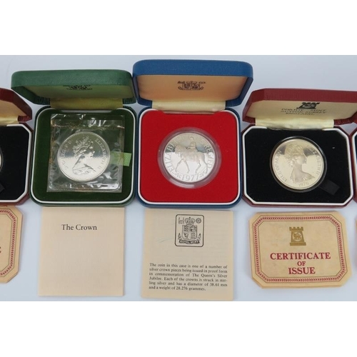 150 - Seven British Royal Mint and Pobjoy Mint silver coins, 20th century. Presentation boxes and paperwor... 