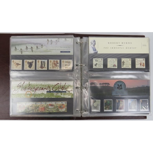 153 - A collection of First Day Cover stamps contained within one large Royal Mail Presentation book, late... 