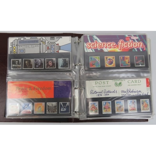 153 - A collection of First Day Cover stamps contained within one large Royal Mail Presentation book, late... 