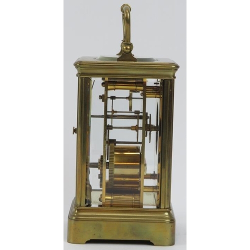 154 - A French gilt brass cased carriage clock retailed by J W Benson of London. With an enamelled white d... 