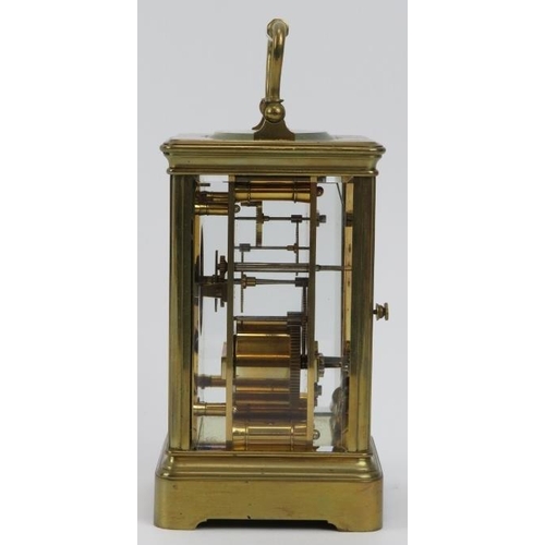 154 - A French gilt brass cased carriage clock retailed by J W Benson of London. With an enamelled white d... 