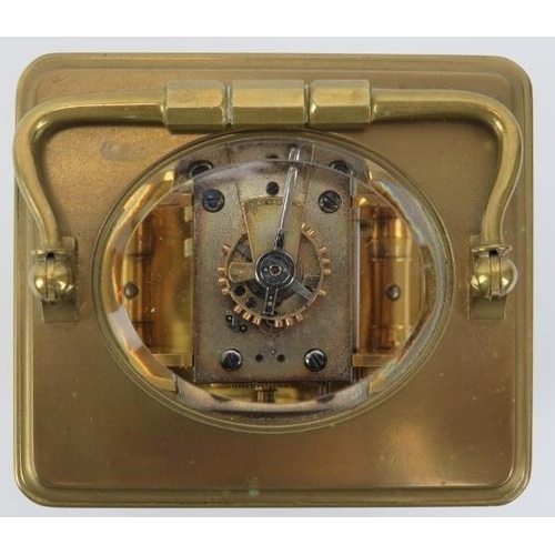 154 - A French gilt brass cased carriage clock retailed by J W Benson of London. With an enamelled white d... 