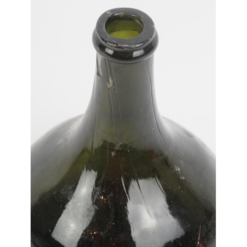 22 - A Georgian dark green glass wine bottle, 18th/19th century. Of onion mallet form with a moulded J&B ... 