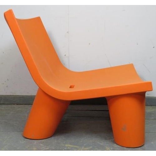 27 - A Slide ‘Low Lita’ orange polyethylene easy chair by the Italian designer Paola Navone, early 21st c... 