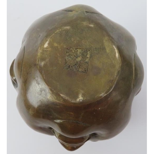 37 - A Chinese bronze four faced Buddha head paperweight, 20th century. Decorated with four contrasting f... 