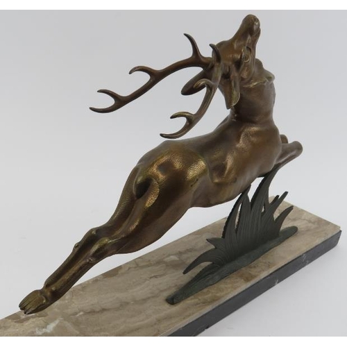 40 - A large French Art Deco bronzed metal sculpture of a leaping stag, early/mid 20th century. Mounted o... 