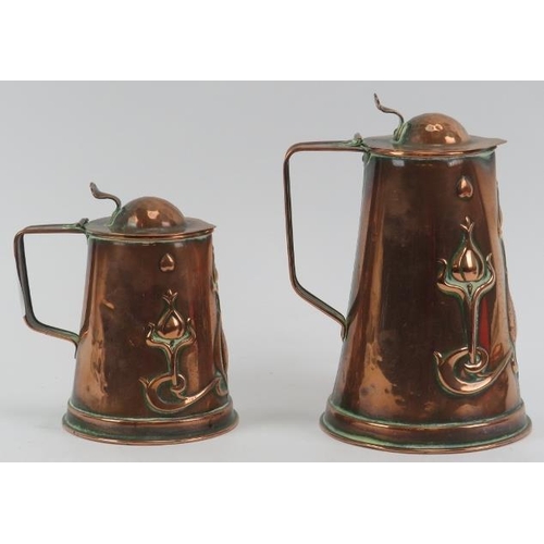 42 - Two Art Nouveau copper lidded jugs by John Sankey & Sons together with a WMF Art nouveau copper salv... 