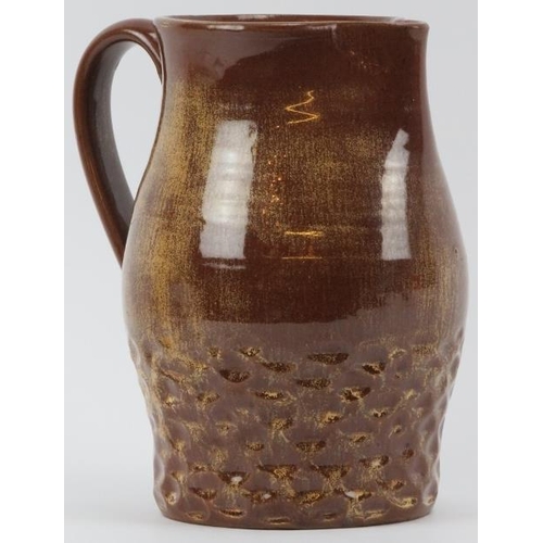 45 - A Susie Cooper brown glazed studio pottery jug, mid 20th century. Incised ’Susie Cooper England’ wit... 