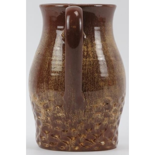 45 - A Susie Cooper brown glazed studio pottery jug, mid 20th century. Incised ’Susie Cooper England’ wit... 