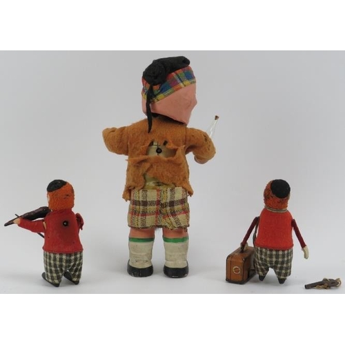 47 - Three vintage clockwork tinplate toy model figures. Comprising a Schuco violin playing clown, a Schu... 