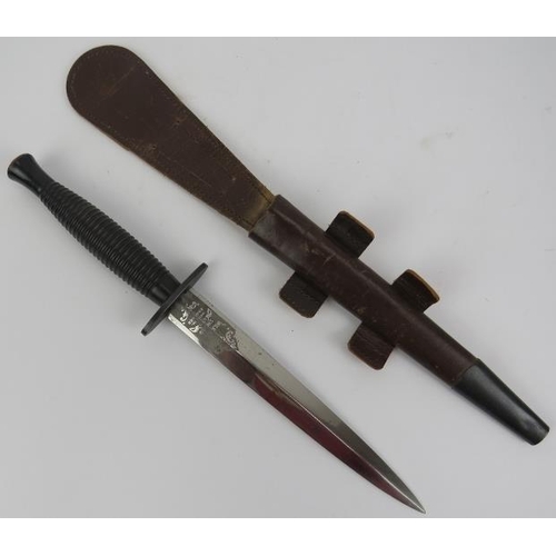 52 - Militaria: A British Commando Fairbairn-Sykes fighting dagger with scabbard, 3rd Pattern, circa 1950... 