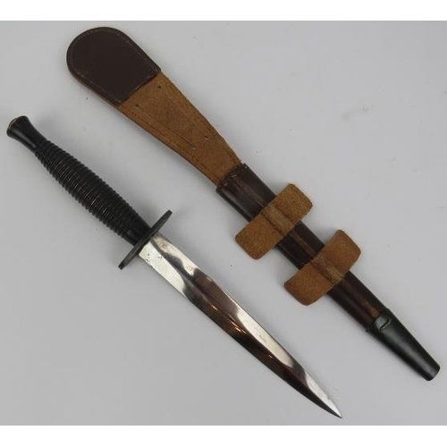 52 - Militaria: A British Commando Fairbairn-Sykes fighting dagger with scabbard, 3rd Pattern, circa 1950... 