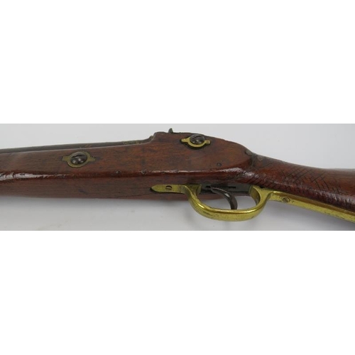 54 - A percussion cap rifle, 19th century. Probably an Enfield rifle. With brass guard and mounts, the ca... 