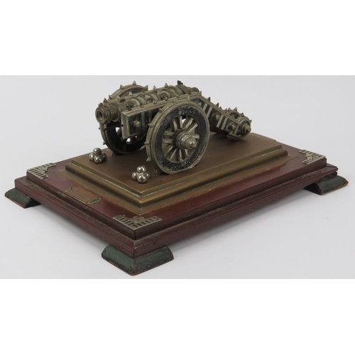 55 - A rare Anglo Indian cast metal and wood model of the Zamzamah cannon gun displayed on a wooden plint... 