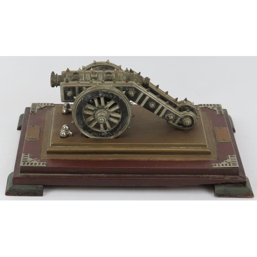 55 - A rare Anglo Indian cast metal and wood model of the Zamzamah cannon gun displayed on a wooden plint... 