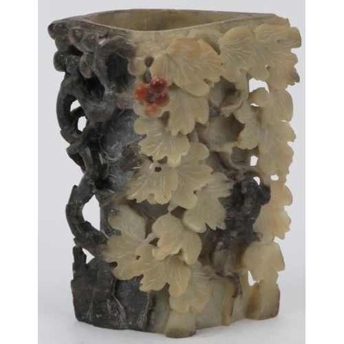 59 - A Chinese carved hardstone brush washer cup, 20th century. Decorated with a grape vine carved in rel... 