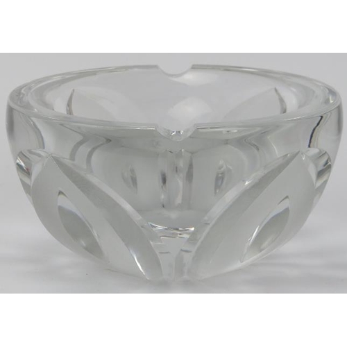 60 - A large European clear glass ashtray, 20th century. Of bowl form with a frosted petal design. Signed... 