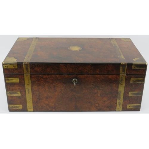 64 - A large Victorian brass bound walnut campaign writing slope. The hinged cover opening to reveal a fi... 