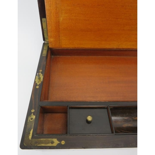 64 - A large Victorian brass bound walnut campaign writing slope. The hinged cover opening to reveal a fi... 