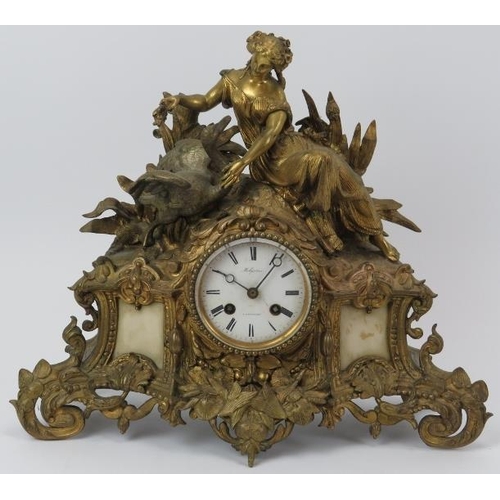 67 - A French Louis XV revival ormolu and alabaster mantel clock, 19th century. The enamelled white dial ... 