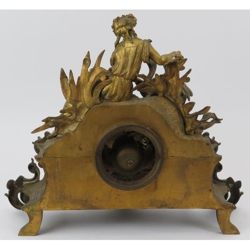 67 - A French Louis XV revival ormolu and alabaster mantel clock, 19th century. The enamelled white dial ... 