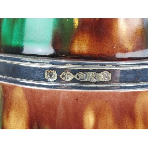 71 - A Victorian Egyptian revival swing handled biscuit barrel with plated silver mounts. The cover mount... 