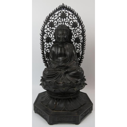 90 - A Chinese carved and ebonised wood Buddhist trinity, 20th century. Each Buddha depicted seated in dh... 