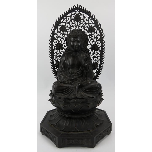 90 - A Chinese carved and ebonised wood Buddhist trinity, 20th century. Each Buddha depicted seated in dh... 