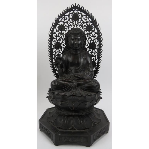 90 - A Chinese carved and ebonised wood Buddhist trinity, 20th century. Each Buddha depicted seated in dh... 