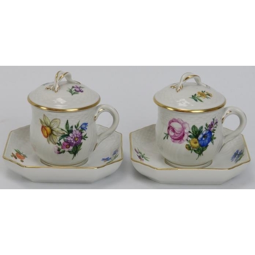 99 - A pair of Royal Copenhagen porcelain chocolate cups with covers and saucers, dated 1941. Both gilt d... 