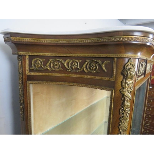 704 - A vintage French vitrine in the Louis XV style, early/mid 20th century, having a marble top above th... 