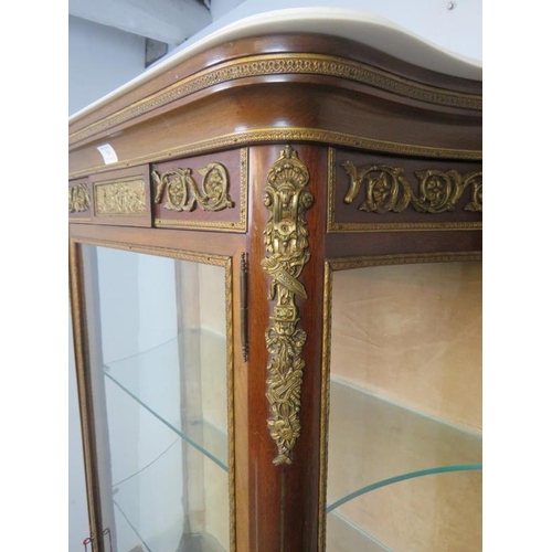 704 - A vintage French vitrine in the Louis XV style, early/mid 20th century, having a marble top above th... 