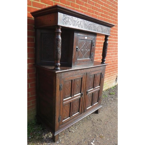 721 - A 17th century and later oak court cupboard, the top section with central cupboard flanked by relief... 