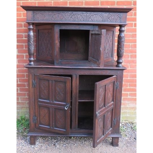 721 - A 17th century and later oak court cupboard, the top section with central cupboard flanked by relief... 