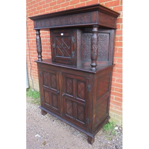 721 - A 17th century and later oak court cupboard, the top section with central cupboard flanked by relief... 