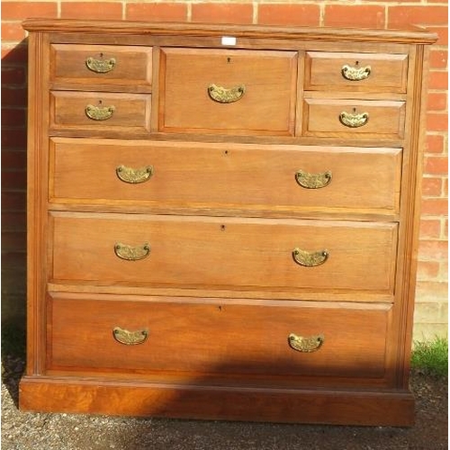 722 - A turn of the century walnut bedroom chest, the central hat drawer flanked by four short drawers, ab... 