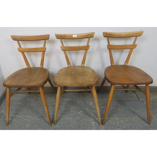 726 - Three mid-century elm and beech ‘green dot’ stacking chairs by Ercol, on canted supports with an ‘H’... 