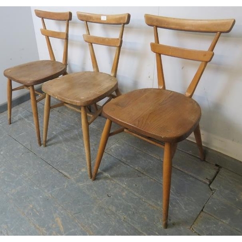 726 - Three mid-century elm and beech ‘green dot’ stacking chairs by Ercol, on canted supports with an ‘H’... 