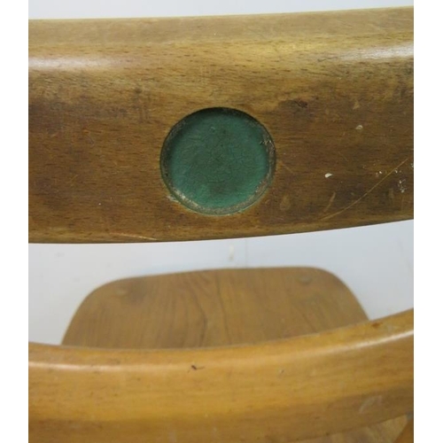 726 - Three mid-century elm and beech ‘green dot’ stacking chairs by Ercol, on canted supports with an ‘H’... 