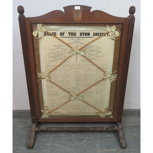 727 - A large antique firescreen featuring ‘The Rules of Eton’ within an oak frame, having reeded uprights... 