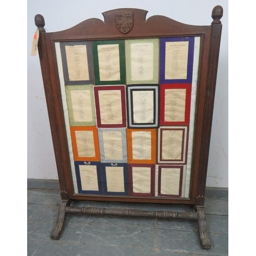 727 - A large antique firescreen featuring ‘The Rules of Eton’ within an oak frame, having reeded uprights... 