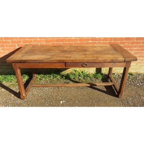 728 - A 19th century rustic French farmhouse kitchen table of good patina, having a side drawer and an end... 