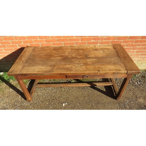 728 - A 19th century rustic French farmhouse kitchen table of good patina, having a side drawer and an end... 