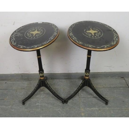 729 - A pair of French Empire style ebonised oval tilt-top tables, hand-painted with Classical motifs and ... 