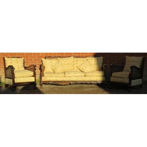 733 - A vintage early/mid 20th century Bergere three piece lounge suite, comprising a three seater settee,... 