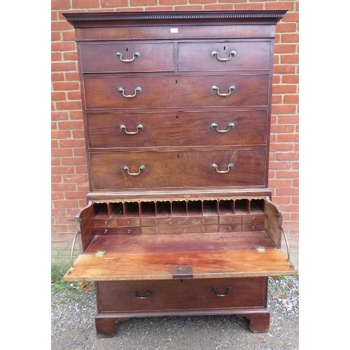 734 - A George III mahogany secretaire chest on chest, having a dentil cornice above two short over three ... 